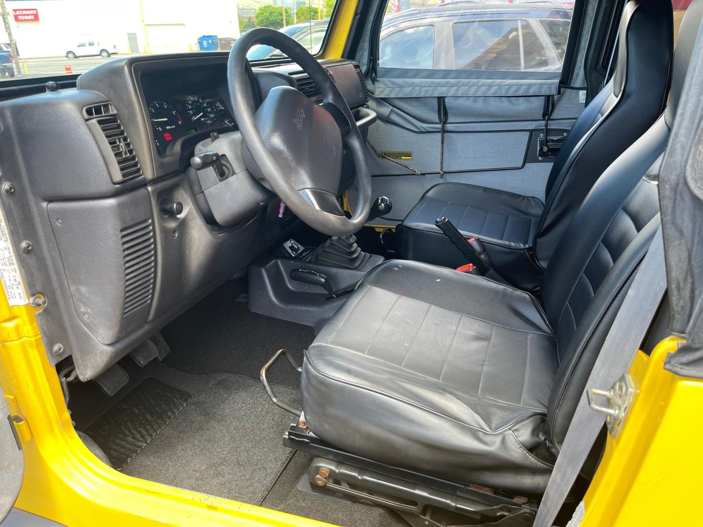 2000 Solar Yellow /Black Jeep Wrangler SE (1J4FA29P9YP) with an 2.5L 4 Cyl. engine, Manual transmission, located at 801 South State Street, Salt Lake City, UT, 84111, (801) 328-0098, 40.751953, -111.888206 - Wow extremely rare to find extra clean Jeep in immaculate condition 4x4! Low miles only 98,248 miles! Interior and exterior are both in excellent shape for the year. This is a clean title no reported accidents on the CarFax history report. It has passed emissions already and is ready to go. Featur - Photo#19